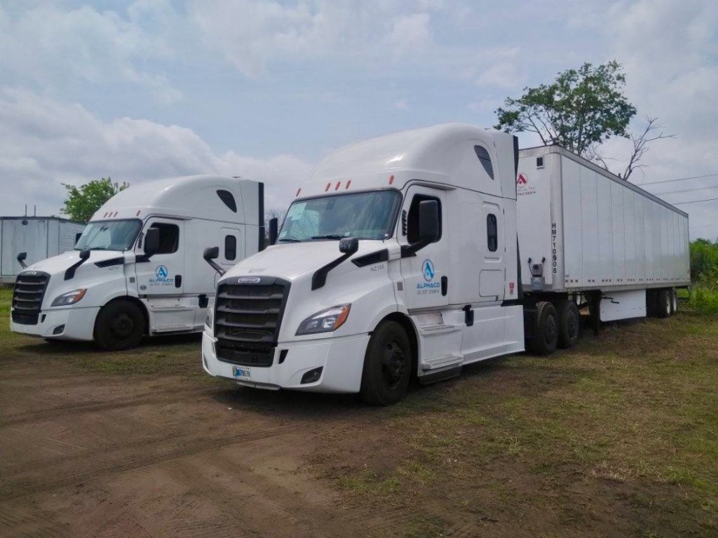 AlphaCo dry van tractors and trailer at company yard